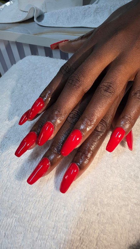 Glossy nail set in a salon gallery